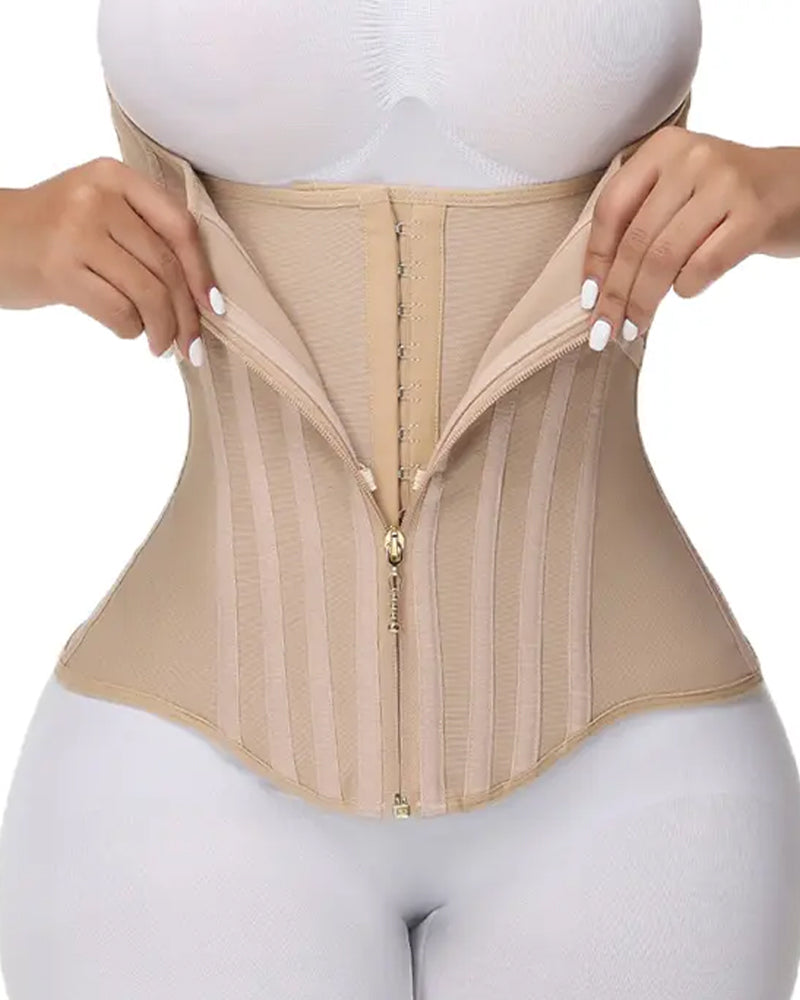 Close-up of beige waist trainer corset with front zipper fastening and structured boning, shaping compression garment for women UK