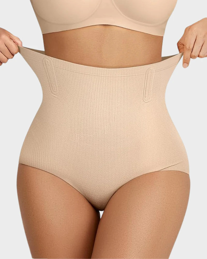 Bellvian beige stretch high waist body shaper with tummy flattening compression and seamless contour sculpting support, designed for waist slimming, smooth body shaping and invisible support under dresses in the UK