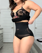 Bellvian black high waist real fit tummy control shapewear panties shown on body with seamless sculpting support designed to flatten stomach, smooth waist and enhance curves invisibly under everyday and occasion outfits