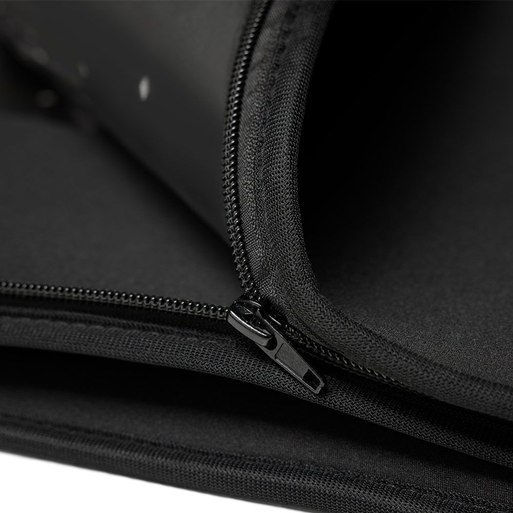 Close-up of the black fabric, stitching and zipper mechanism on the NACRE FORM™ Full Body Red Light Therapy Blanket, highlighting the convertible modular construction that allows the wraparound LED therapy blanket to separate into two individual red light therapy mats.