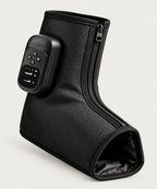 NACRE FORM™ cordless air compression foot and ankle massager shown as a single black massage boot against a premium beige background. This rechargeable electric foot massager features a digital control panel, adjustable massage modes, compression intensity settings, soothing heat, textured fabric and a side zip. The portable heated foot and ankle massager is designed for personalised relaxation and everyday foot comfort at home.