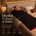 Man relaxing comfortably in bed while using the NACRE FORM™ Full Body Red Light Therapy Blanket in a luxurious, warm-toned bedroom. The flexible black wraparound LED therapy blanket covers his body, with a subtle red LED glow visible near the edges. Featuring 660nm red light, 850nm near-infrared technology and 2,520 LEDs, this full-body light therapy blanket is designed for convenient at-home wellness and relaxation routines. Its convertible design also allows the blanket to separate into two individual red